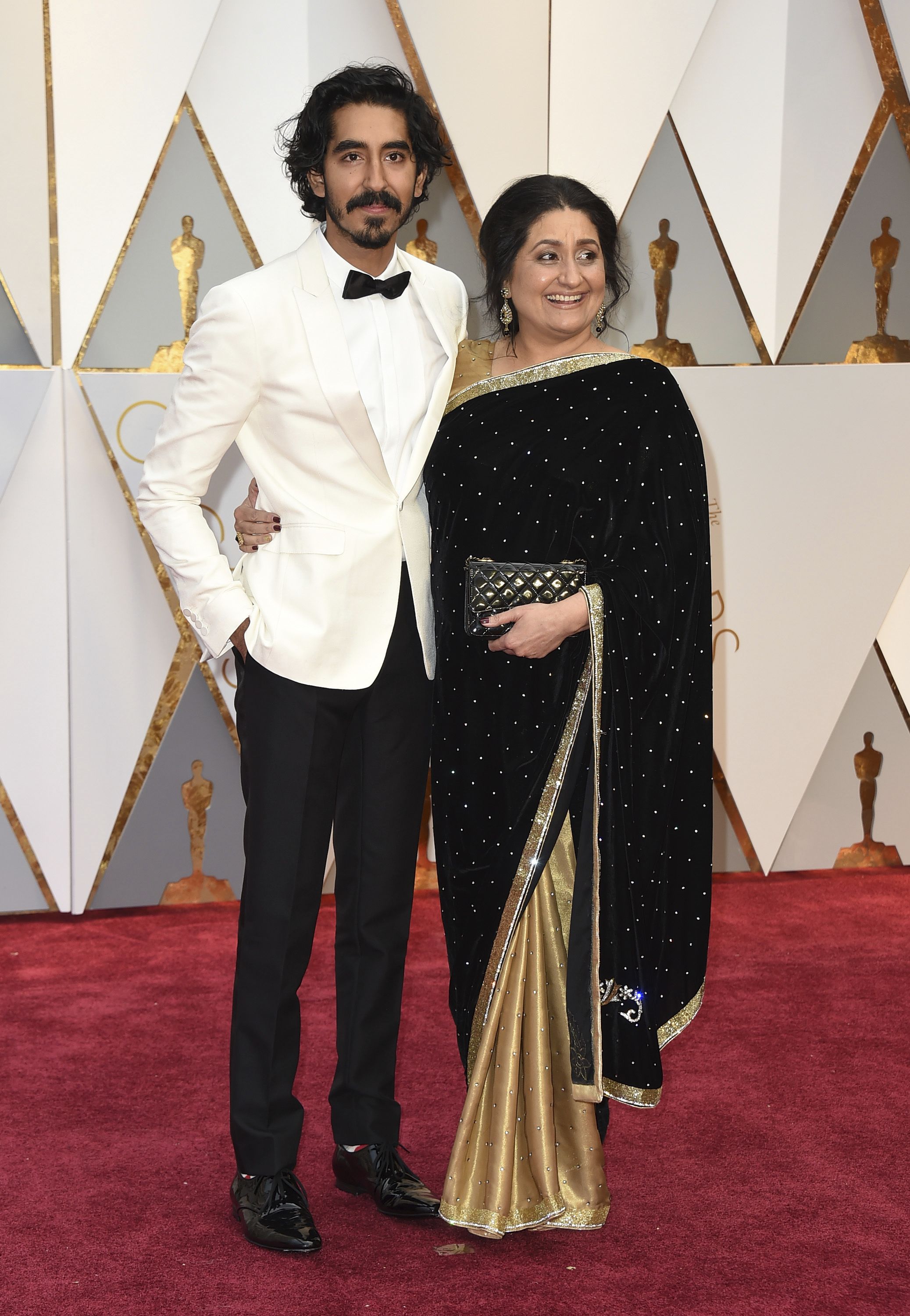 Dev Patel, left, and Anita Patel arrive at the Oscars on Sunday, Feb. 26, 2017, at the Dolby Theatre in Los Angeles. (Photo by Jordan Strauss/Invision/AP)