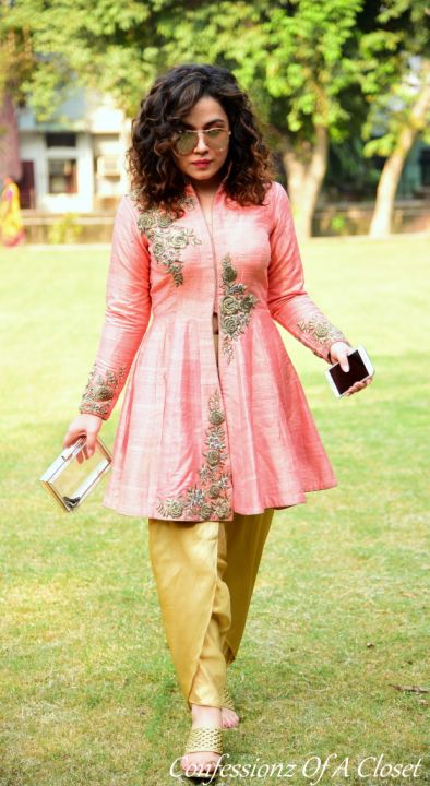 a cool embroidered kurta with a very cool pant, the embroidered gold flowers give the kurta a very classy look